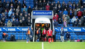The players head to the dressing rooms at half time