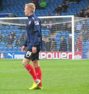 Former Chesterfield youth player Jordan Burrow warms up for Morecambe