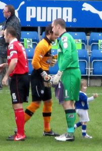 The two goalkeepers, Tommy Lee and Barry Roche, shake hands