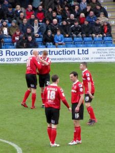 The Morecambe players prepare for kick off
