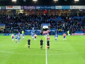 The players head to the dressing rooms at half time with the score 0-0