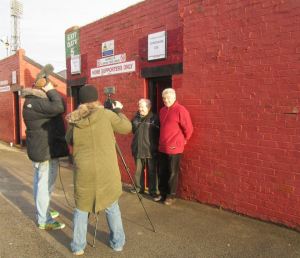 Barnsley supporters are interviewed before the game
