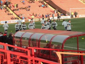 The visitors warm up