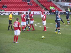 The referee tries to keep control of the players