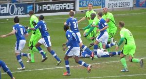 The players desperately battle for the ball