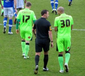 Carlisle speaks to referee Stuart Atwell