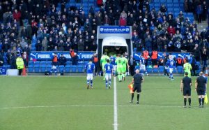 The players head to the dressing rooms at half time
