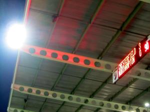 Looking up towards the scoreboard and floodlight