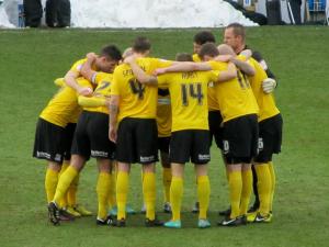 The visitors huddle up prior to the game