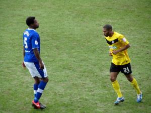 Neal Trotman keeps a close eye on Gavin Tomlin