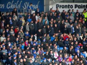 The fans in the Kop watch the match