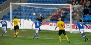 Richards forces a save out of the goalkeeper