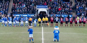 The players line up before kick off