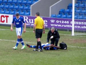Neal Trotman receives treatment early in the game