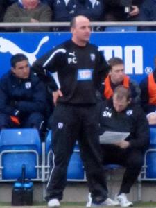 Paul Cook watches the action