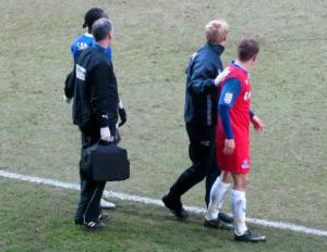 A player from each side wait to rejoin the action