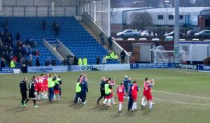 The Gillingham players applaud their travelling supporters
