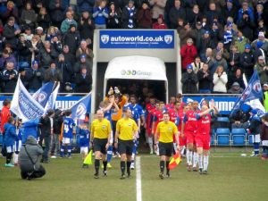 The players make their way on to the pitch