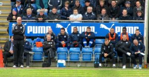 Paul Cook watches from the touchline