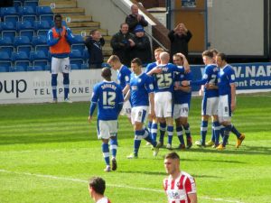The players celebrate the fourth goal