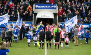 Jack Lester leads out the Spireites
