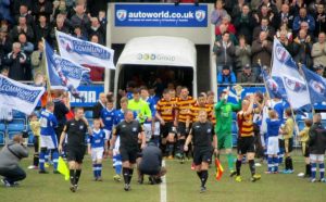 The players make their way on to the pitch