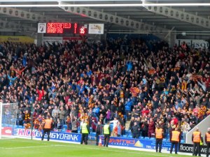 The travelling supporters celebrate the gams first goal
