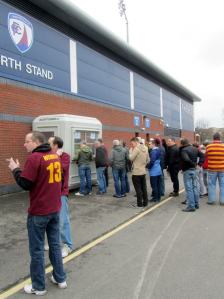 The away supporters queue for their tickets