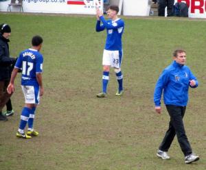 Bradford manager Phil Parkinson heads over to applaud the away supporters