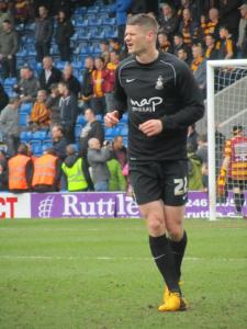 Bradford's Michael Nelson warms up