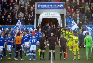The teams make their way on to the pitch