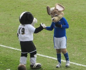 The two mascots shake hands