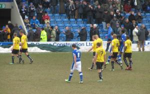 The players head to the dressing room at the interval