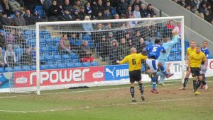 The goalkeeper catches a cross