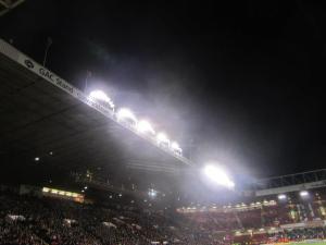 The lights shine over the stadium