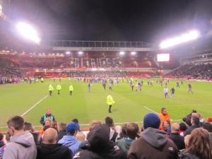 A few supporters invade the pitch at the full time whistle
