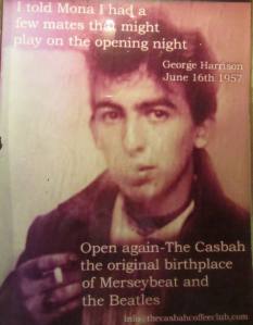A picture of George Harrison in the entrance of the club