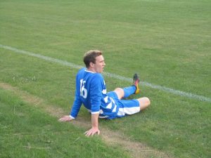 A Hallam player goes down injured