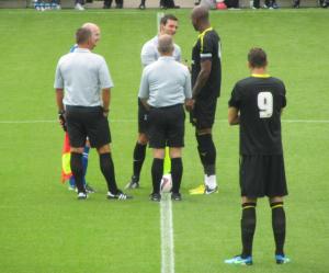 The two captains speak to the referee prior to kick off
