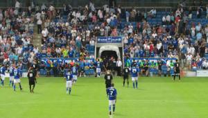 The players head to the dressing rooms at half time