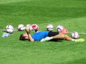Goalkeeper Tommy Lee does some stretches