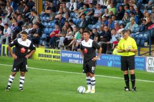 Roberts and Morsy stand over the ball