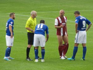 Gary Roberts cheekily pulls down an opposition players shorts!