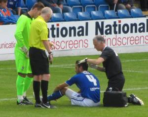 Physio Jamie Hewitt treats Sam Hird