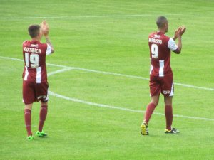 The Cheltenham players show appreciation to their travelling support