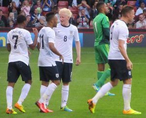The England players congratulate Sterling