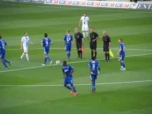 The two teams switch sides after the coin toss