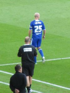 Paul Cook shouts orders to Chesterfield captain Drew Talbot
