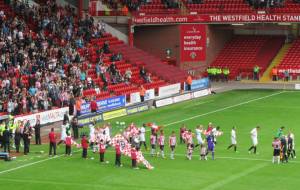 The players make their way onto the pitch