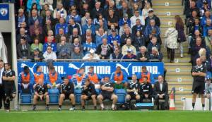 Paul Cook looks on from the touchline